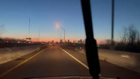 Urban dawn from the highway's heart.